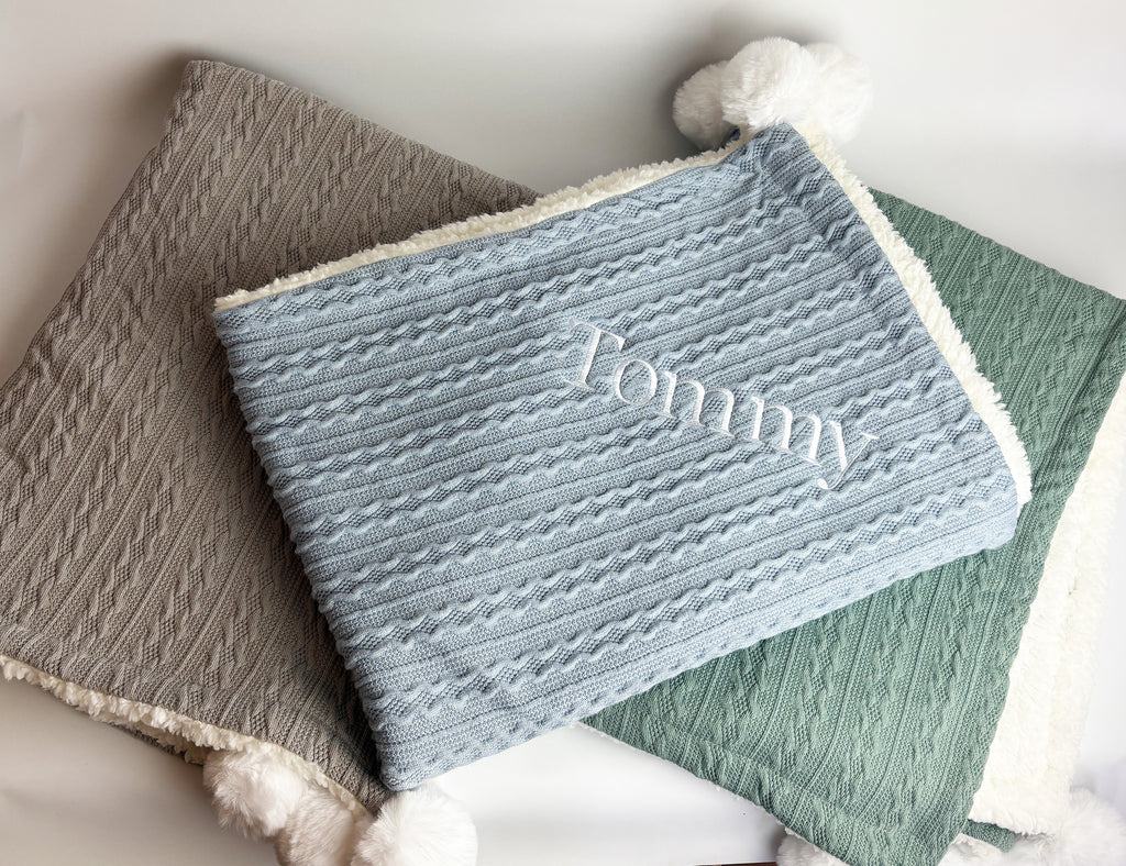 Blue baby blanket with custom embroidered name